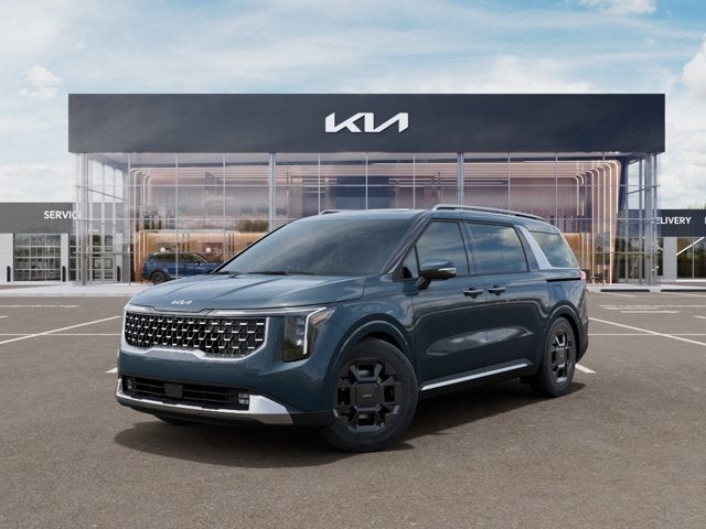 2026 Kia Carnival SX in Astra Blue — front three-quarter view